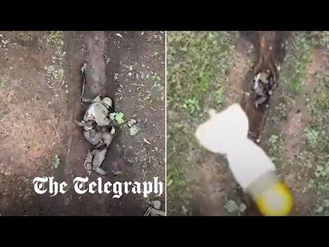 Moment Russian soldier catches and throws away Ukrainian drone bombs - The Telegraph thumbnail